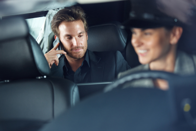 businessman using cellphone in limousine