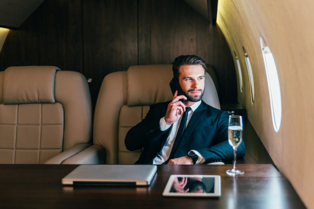 Businessman flying on his private jet